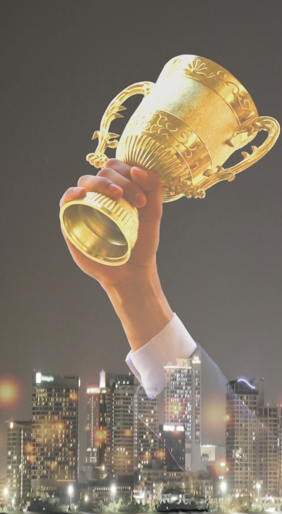 Coworkers celebrating a birthday in the office with a sign